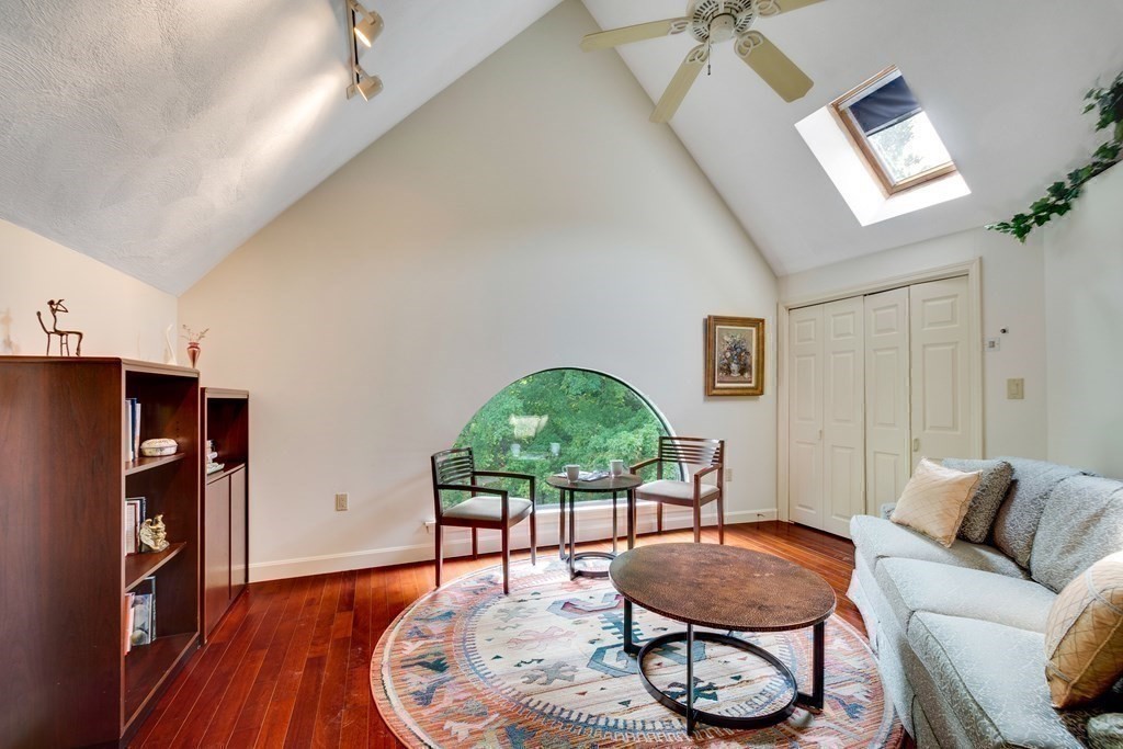149 Andover Street, Unit 10 Andover, MA 01810 - Photo 21 of 30 a living room with furniture a window and wooden floor