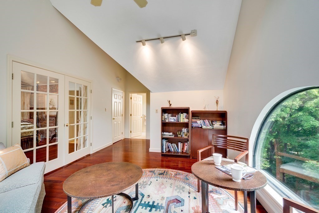 149 Andover Street, Unit 10 Andover, MA 01810 - Photo 22 of 30 a living room with furniture a rug and a large window