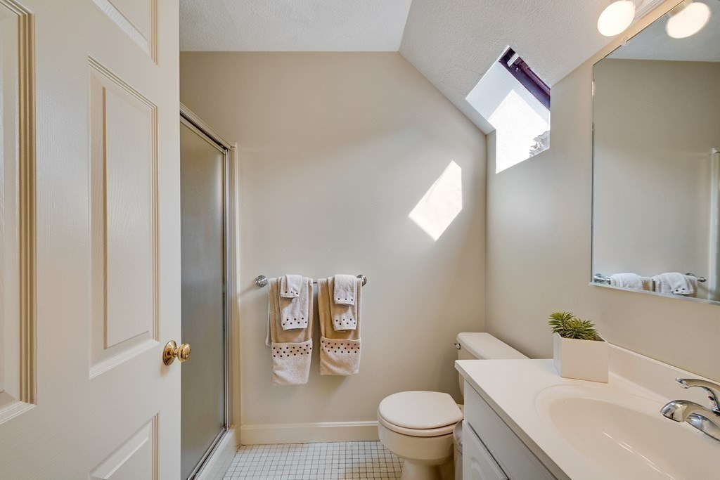 149 Andover Street, Unit 10 Andover, MA 01810 - Photo 23 of 30 a bathroom with a sink toilet and shower