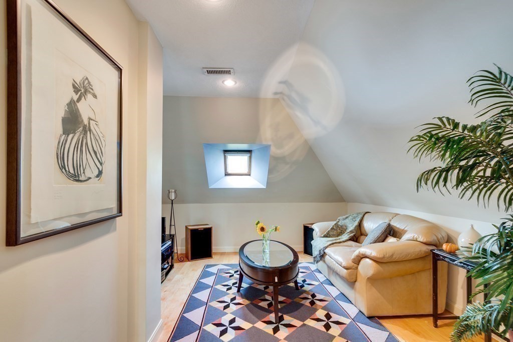 149 Andover Street, Unit 10 Andover, MA 01810 - Photo 25 of 30 a living room with furniture and a potted plant