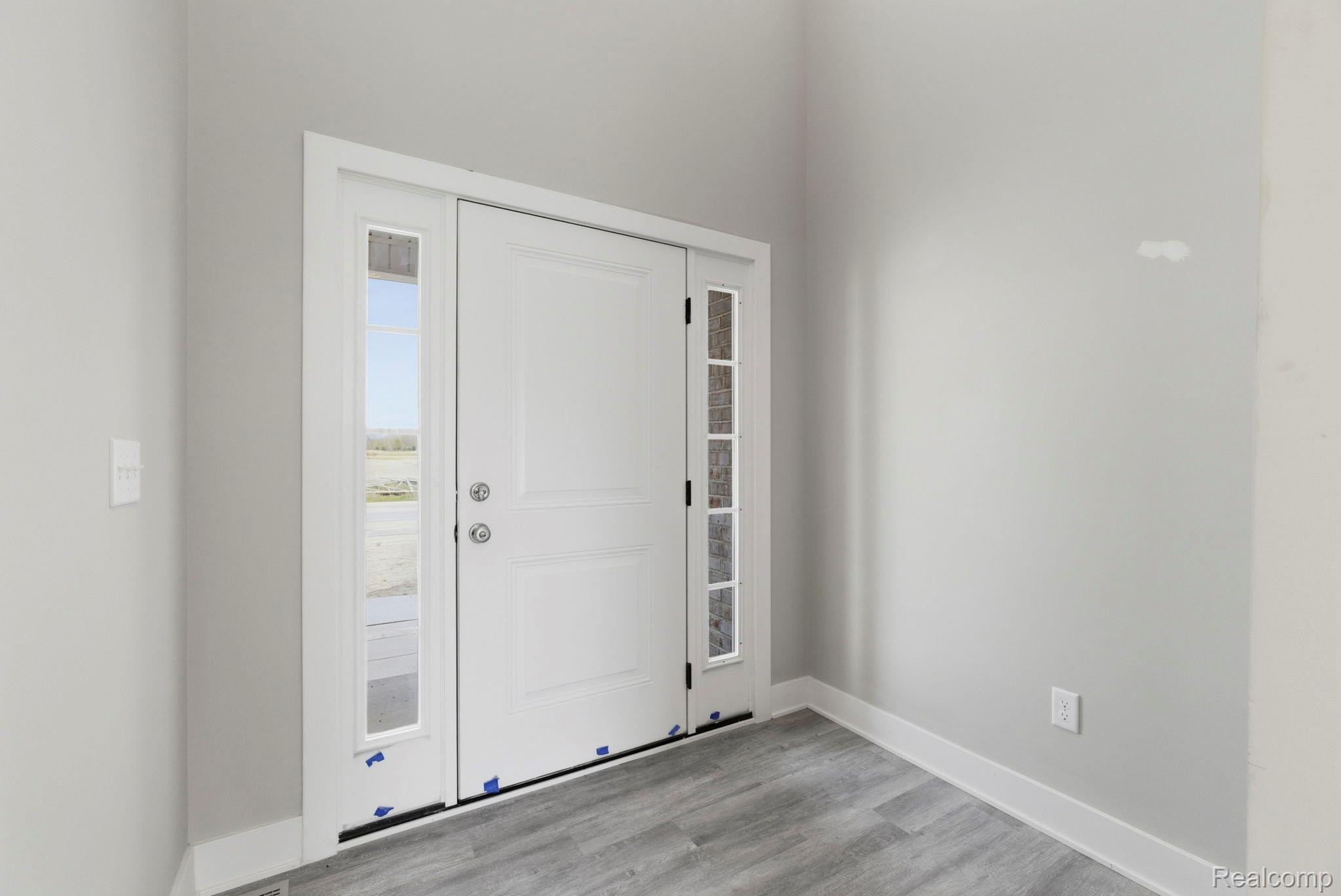 2361 Baltimore Davison, MI 48423 - Photo 3 of 31 Foyer entrance with light wood-style floors and baseboards