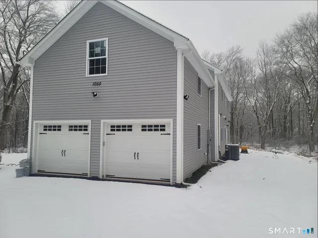 a view of a house with a snow