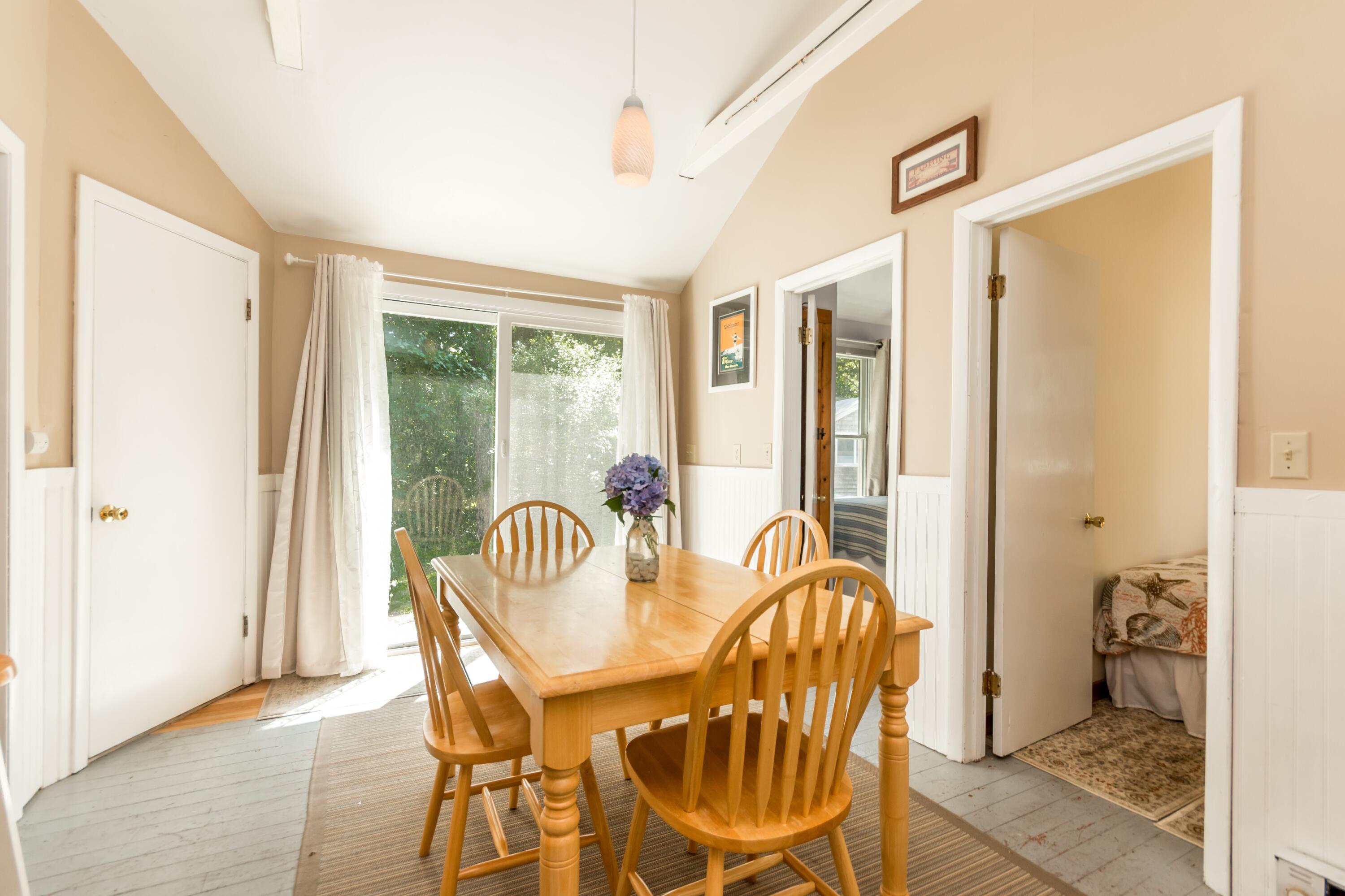 319 South Orleans Road, Unit 2 Orleans, MA 02653 - Photo 14 of 36 Dining room with slider