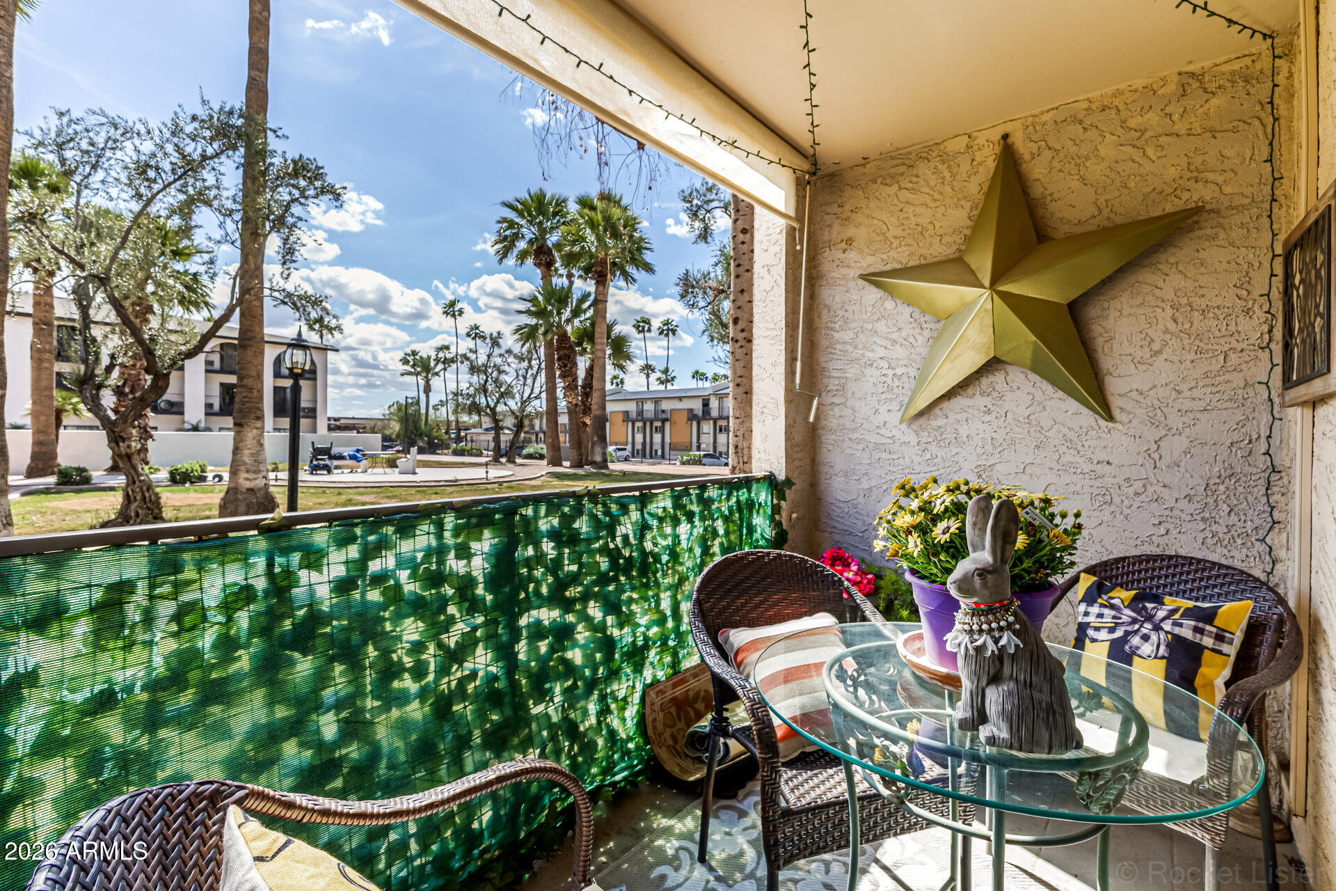 3033 East Devonshire Avenue, Unit 1032 Phoenix, AZ 85016 - Photo 16 of 23 a view of a chairs and table in the balcony