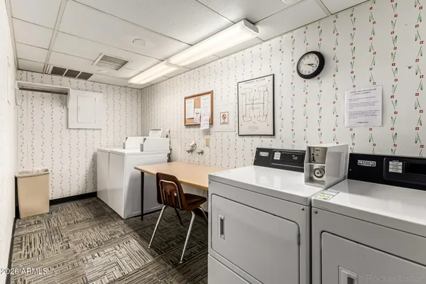 a utility room with closet dryer and washer