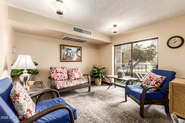 a living room with furniture and a large window
