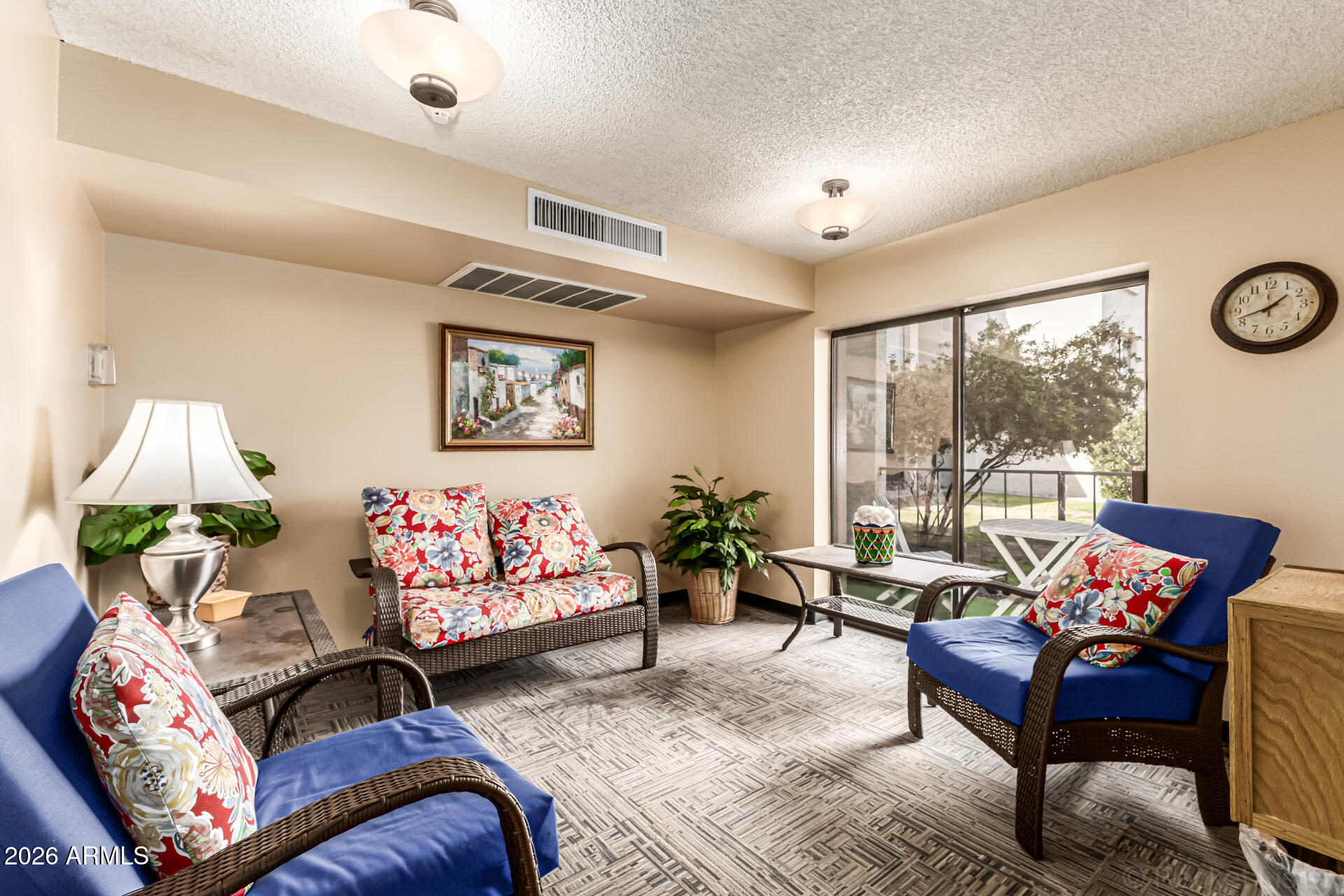 3033 East Devonshire Avenue, Unit 1032 Phoenix, AZ 85016 - Photo 18 of 23 a living room with furniture and a large window