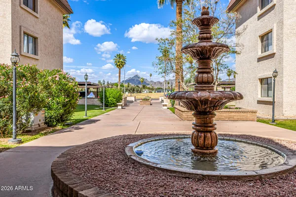 a view of a house with fountain