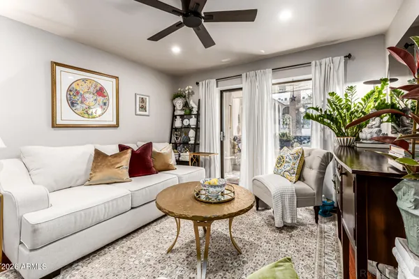 a living room with furniture and a large window