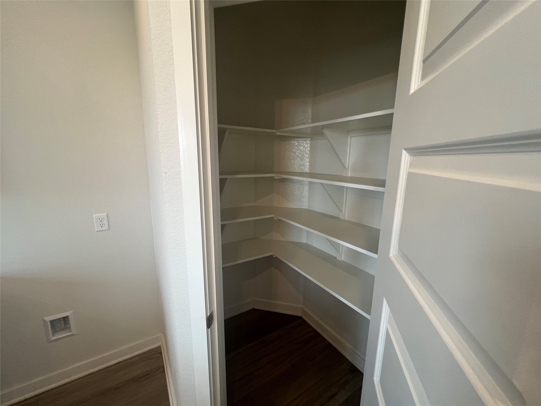 255 Gus Loop Georgetown, TX 78626 - Photo 13 of 24 A deep corner pantry offers abundant storage for culinary essentials.
