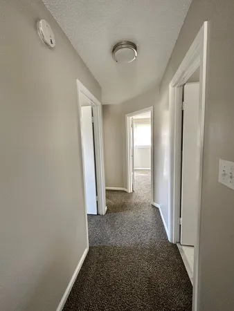 a bathroom with a tub and a window