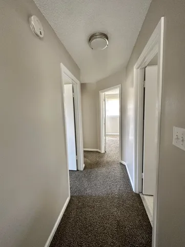 a bathroom with a tub and a window