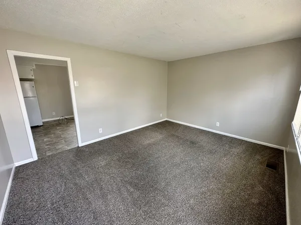 an empty room with a bench