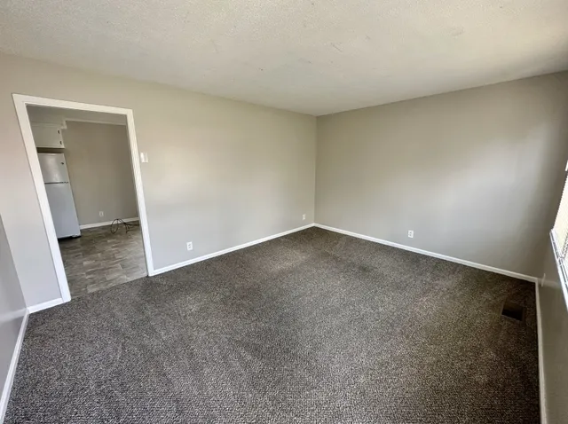 an empty room with a bench