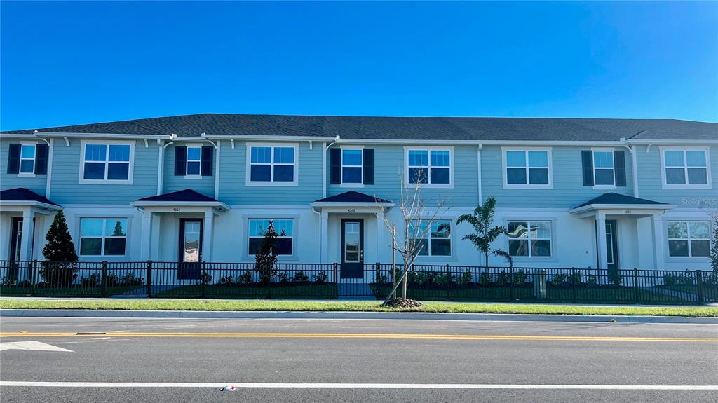 a view of a house in a big yard