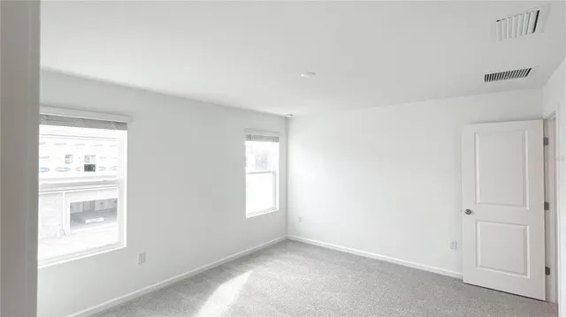 a view of an empty room and window