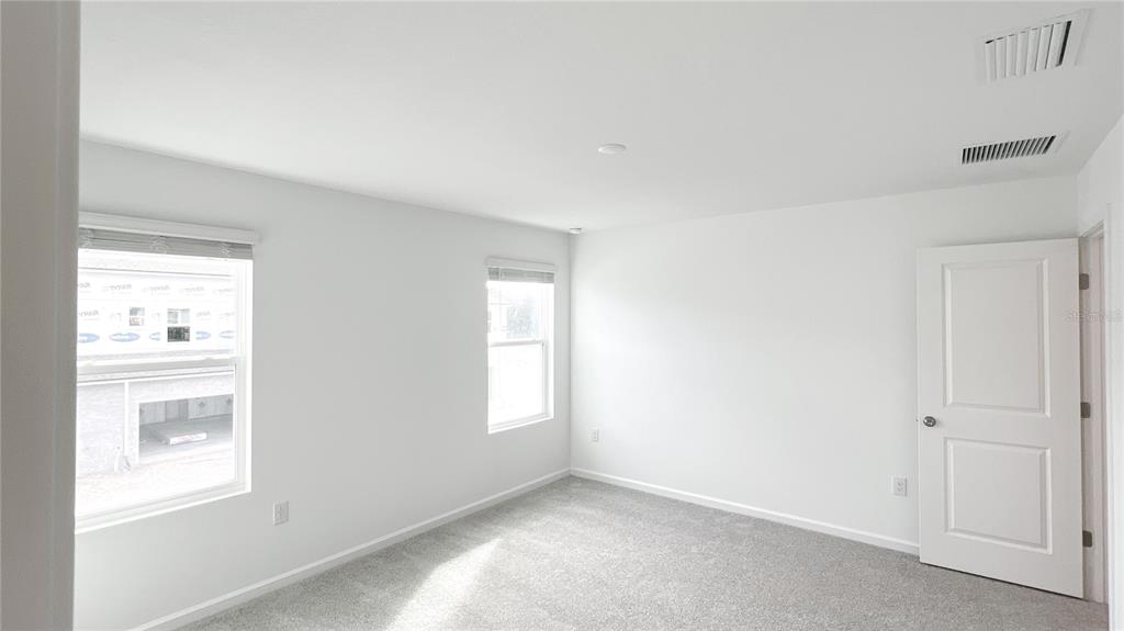 4268 Sadler Road Apopka, FL 32712 - Photo 23 of 28 a view of an empty room and window