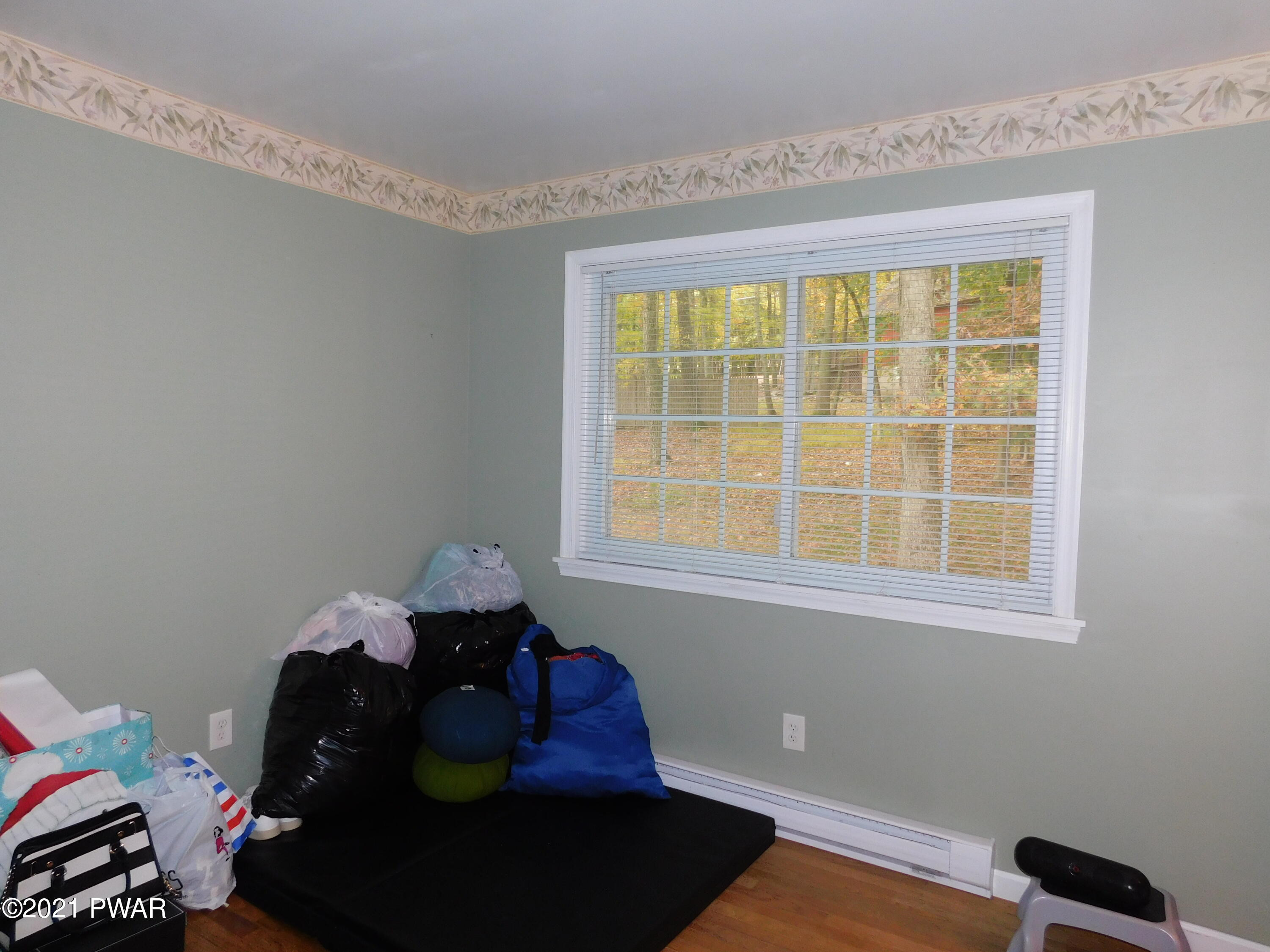 119 Ridge Drive Milford, PA 18337 - Photo 27 of 40 a living room with furniture and a window