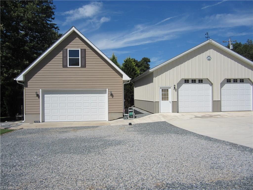 2630 Riverview Road Lexington, NC 27292 - Photo 12 of 18 Main garage with upper level for expansion; detached garage/workshop