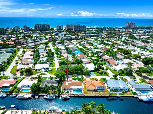 a view of a house with outdoor space and sitting area