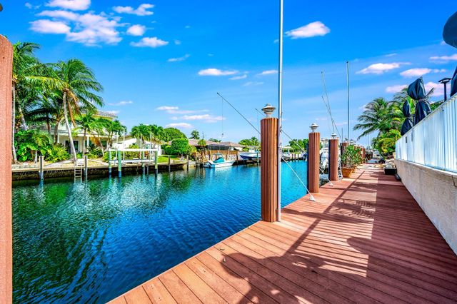 a bedroom with furniture and a large window