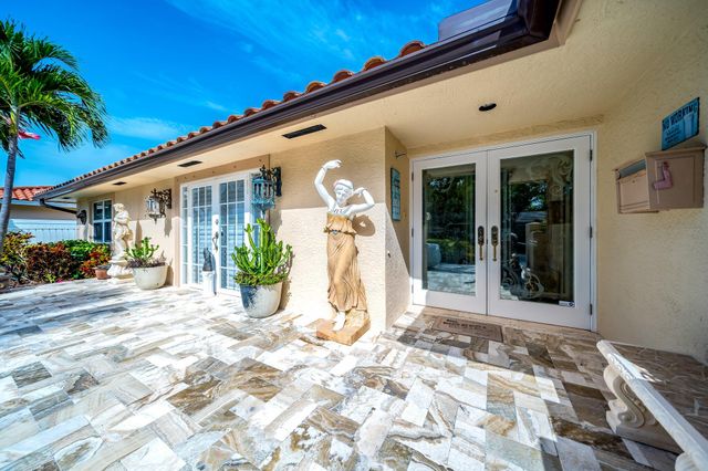 a dining room with furniture and chandelier