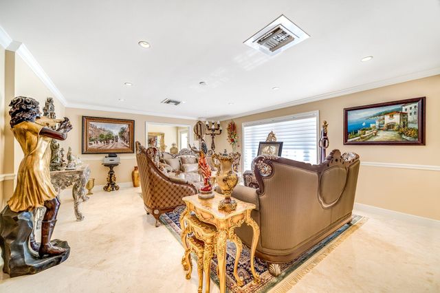 a spacious bathroom with a granite countertop sink and a mirror