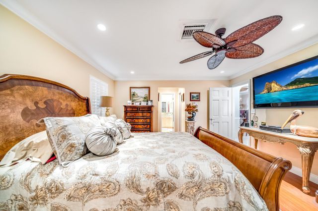 a dining room with kitchen island furniture a chandelier and kitchen view