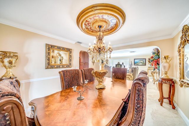 a kitchen with stainless steel appliances granite countertop a refrigerator a sink and dishwasher