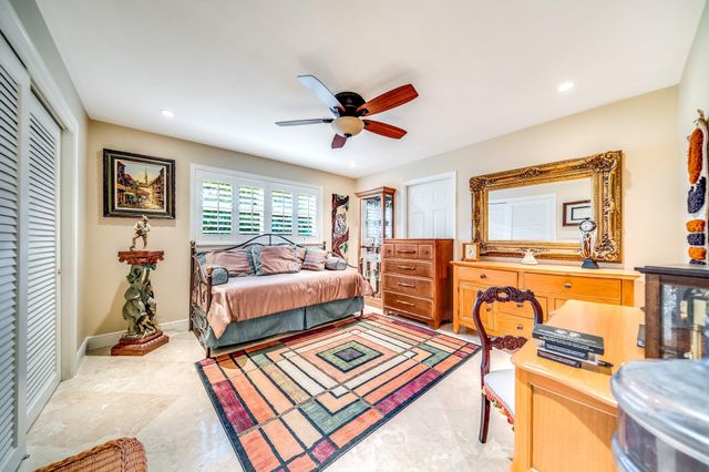 a view of a backyard with sitting area