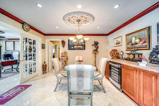 a view of a backyard with a garden and deck