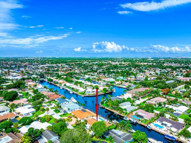 a view of a swimming pool and outdoor seating