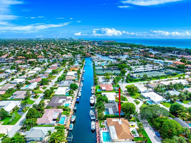 a view of a house with swimming pool and sitting area