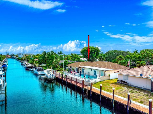 a view of a backyard with sitting area