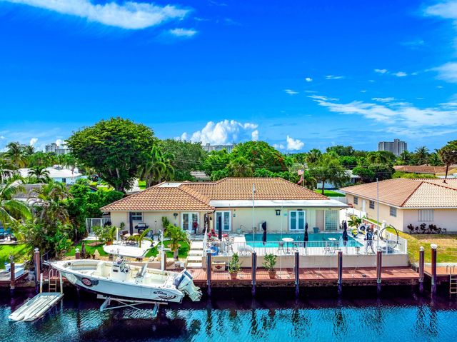 a view of a backyard with sitting area