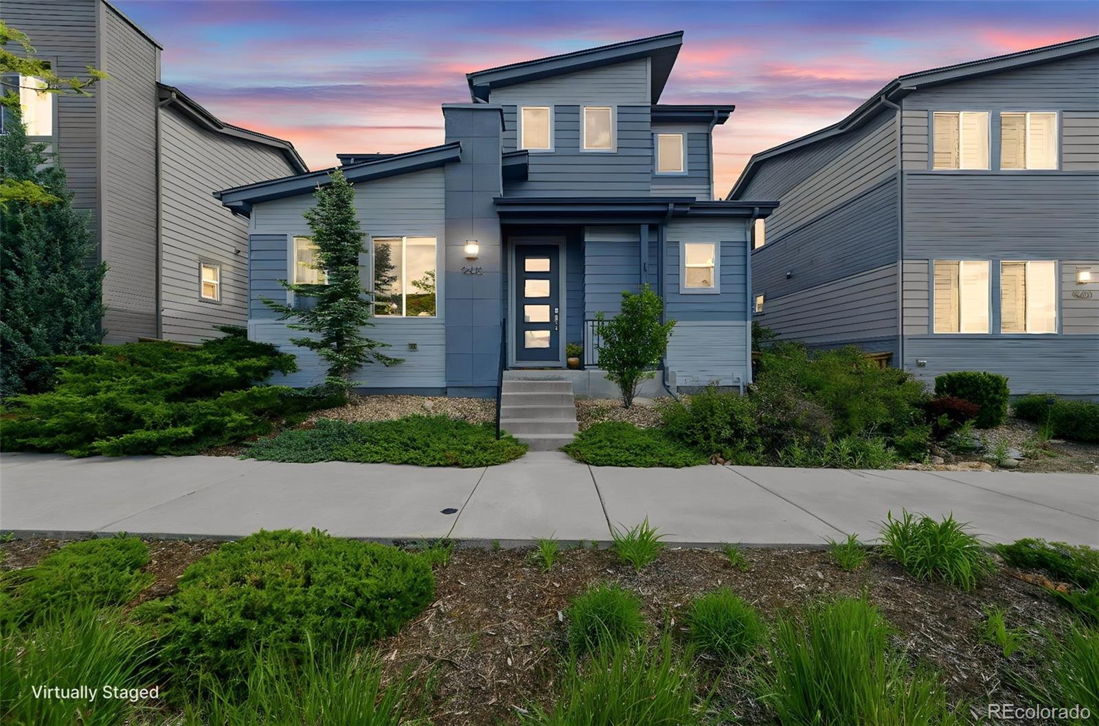 9602 Dunning Circle Highlands Ranch, CO 80126 - Photo 1 of 50 a front view of a house with garden