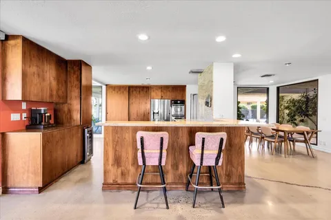 a kitchen with a sink and a stove