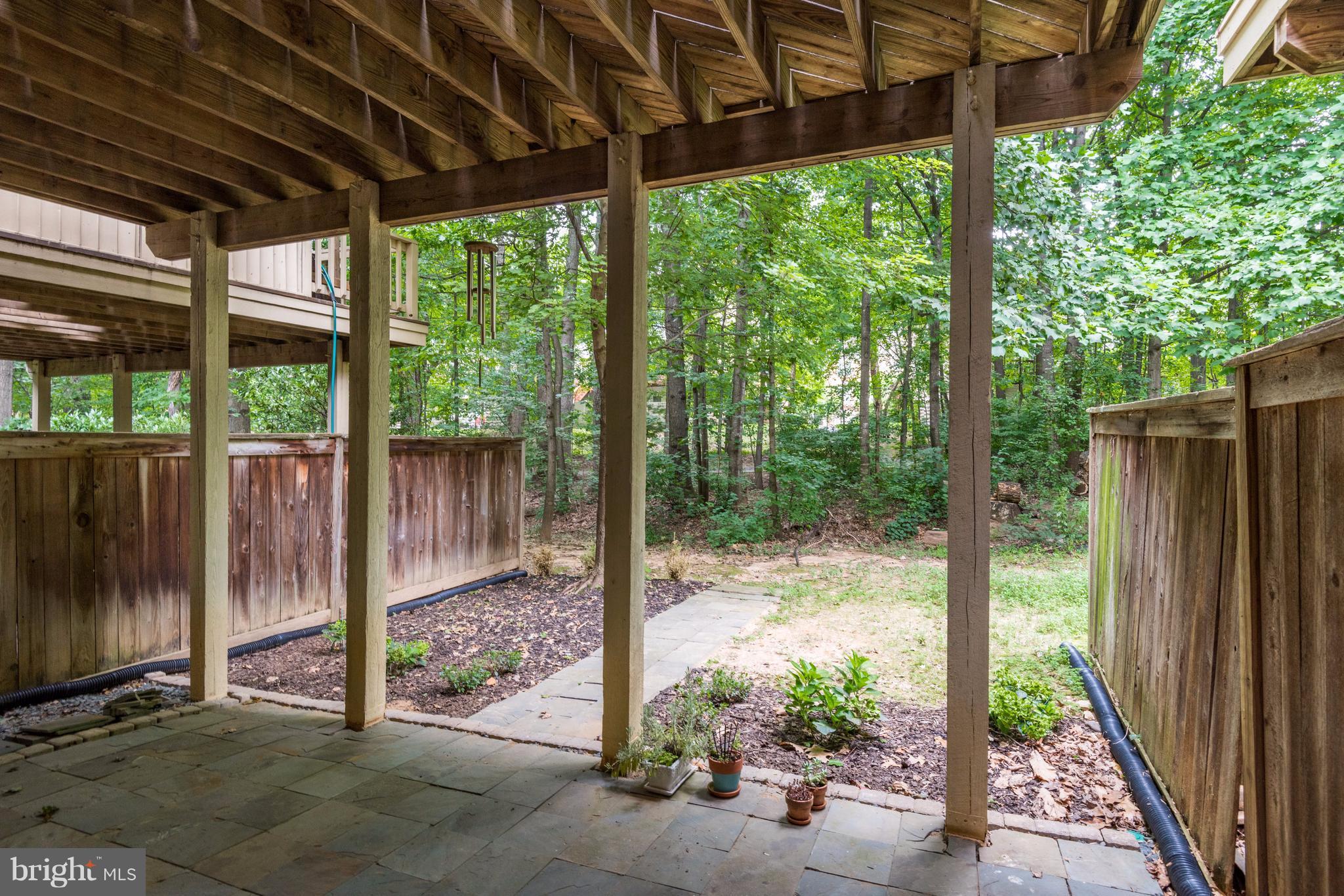 1363 Heritage Oak Way Reston, VA 20194 - Photo 29 of 30 Natural stone paver patio under the deck