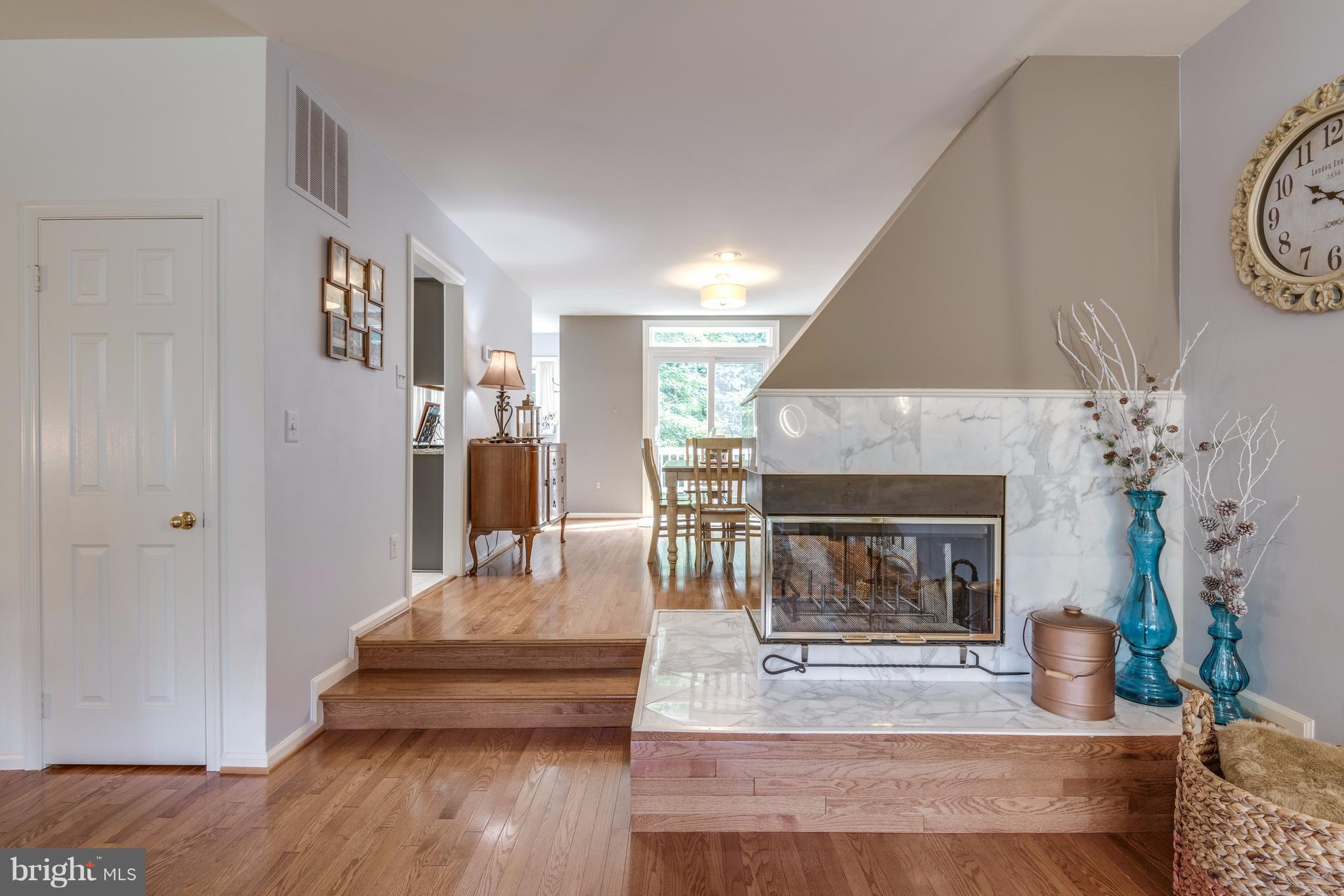 1363 Heritage Oak Way Reston, VA 20194 - Photo 9 of 30 Dramatic 3-sided wood burning FP w/marble surround