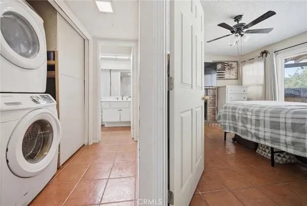 a view of a bedroom with washer and dryer