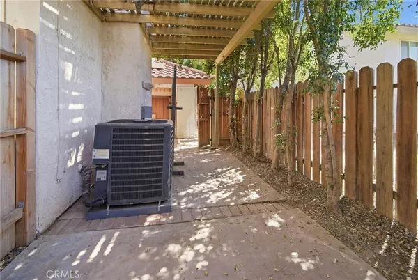 a view of entryway with stairs and wooden fence