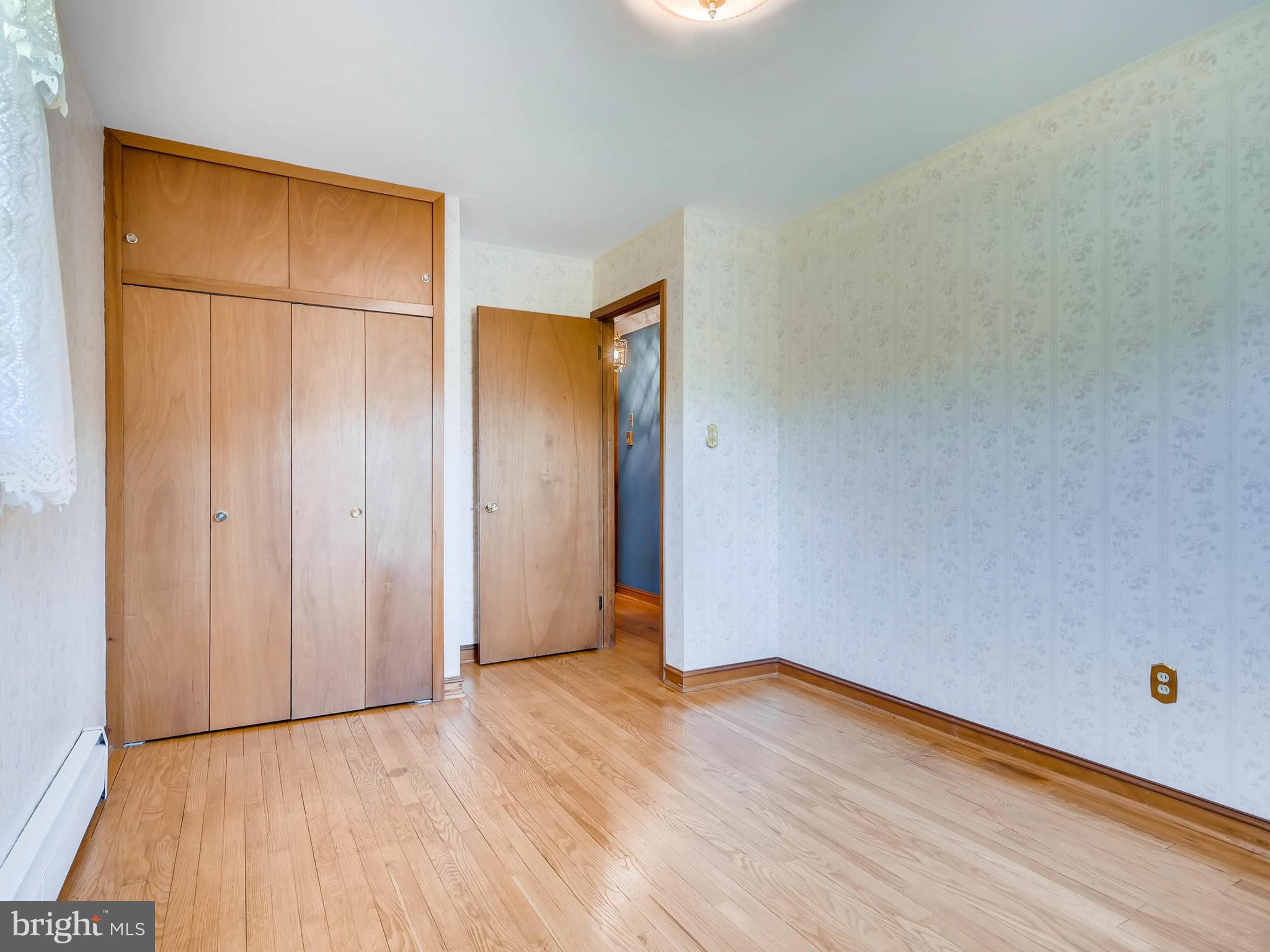 2626 Pleasantville Road Fallston, MD 21047 - Photo 12 of 29 a view of an empty room with wooden floor