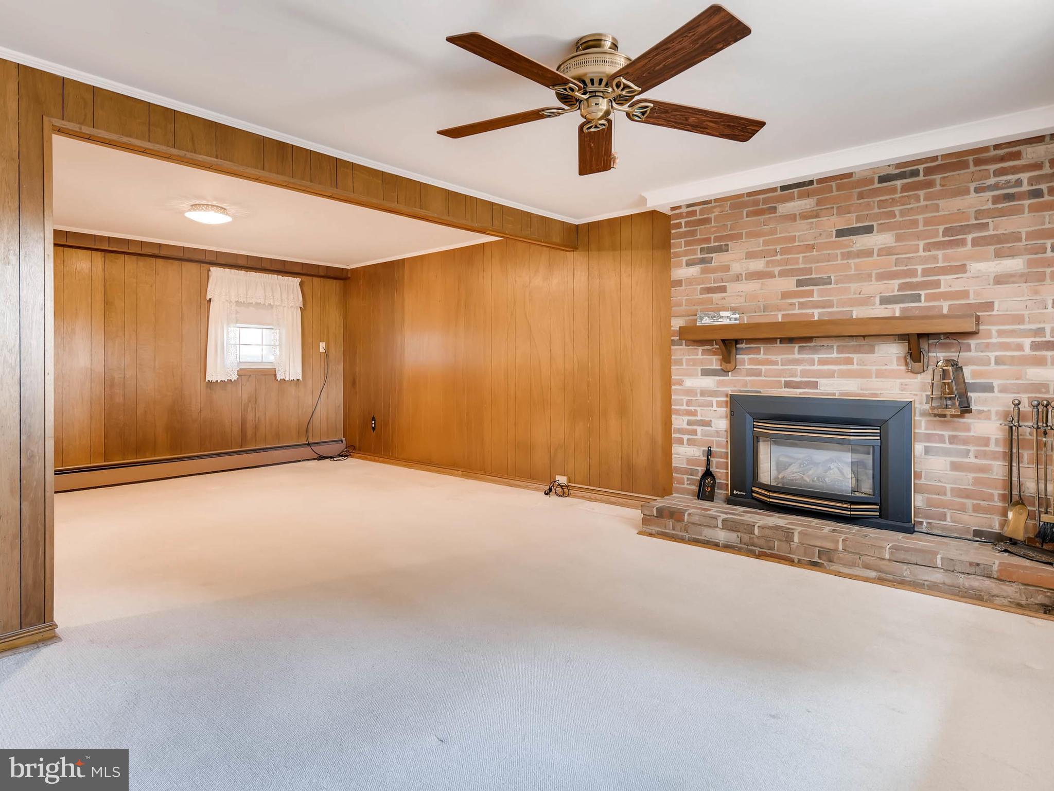 2626 Pleasantville Road Fallston, MD 21047 - Photo 16 of 29 an empty room with windows and fireplace