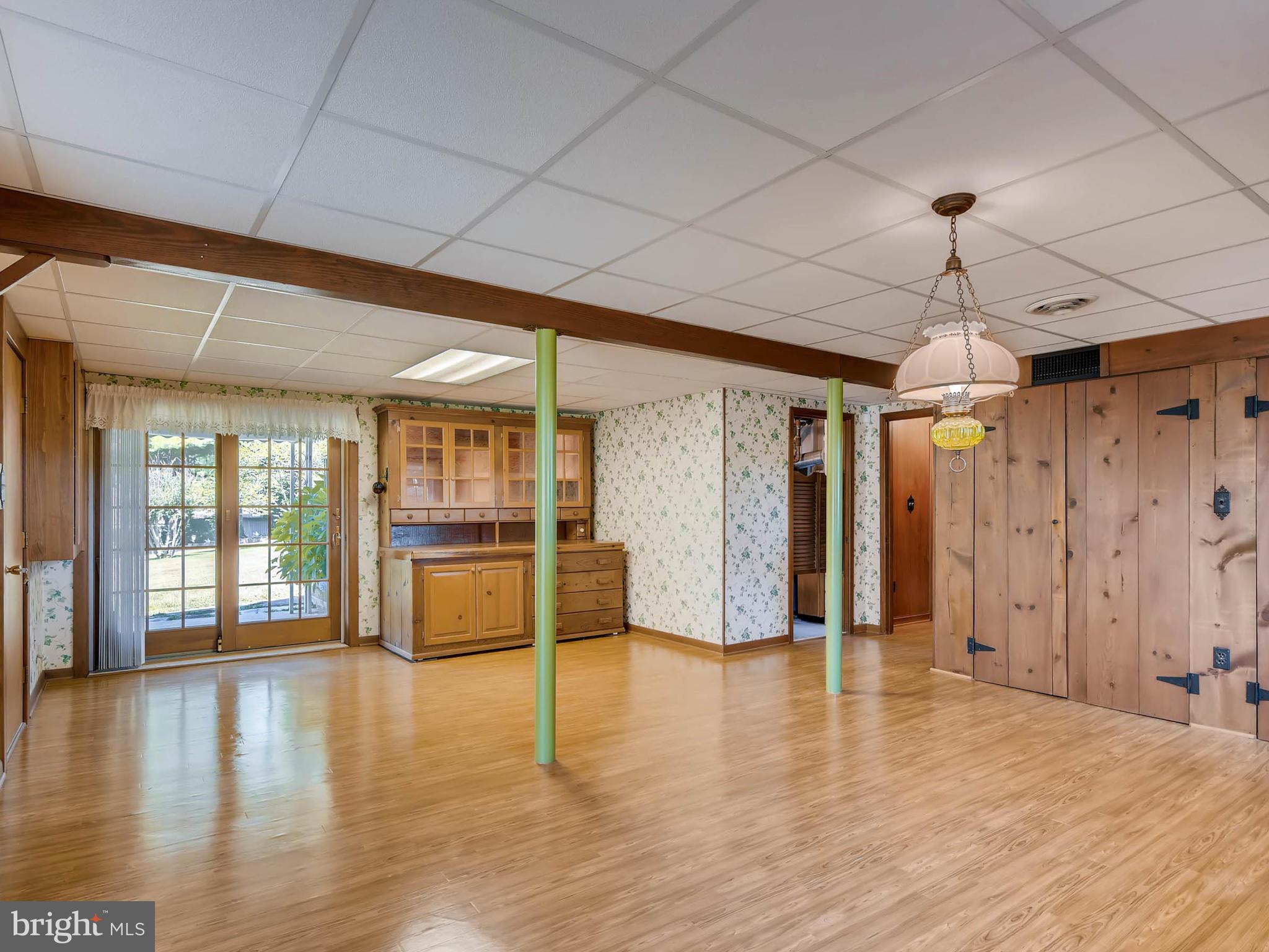 2626 Pleasantville Road Fallston, MD 21047 - Photo 18 of 29 a view of an empty room with wooden floor and a window