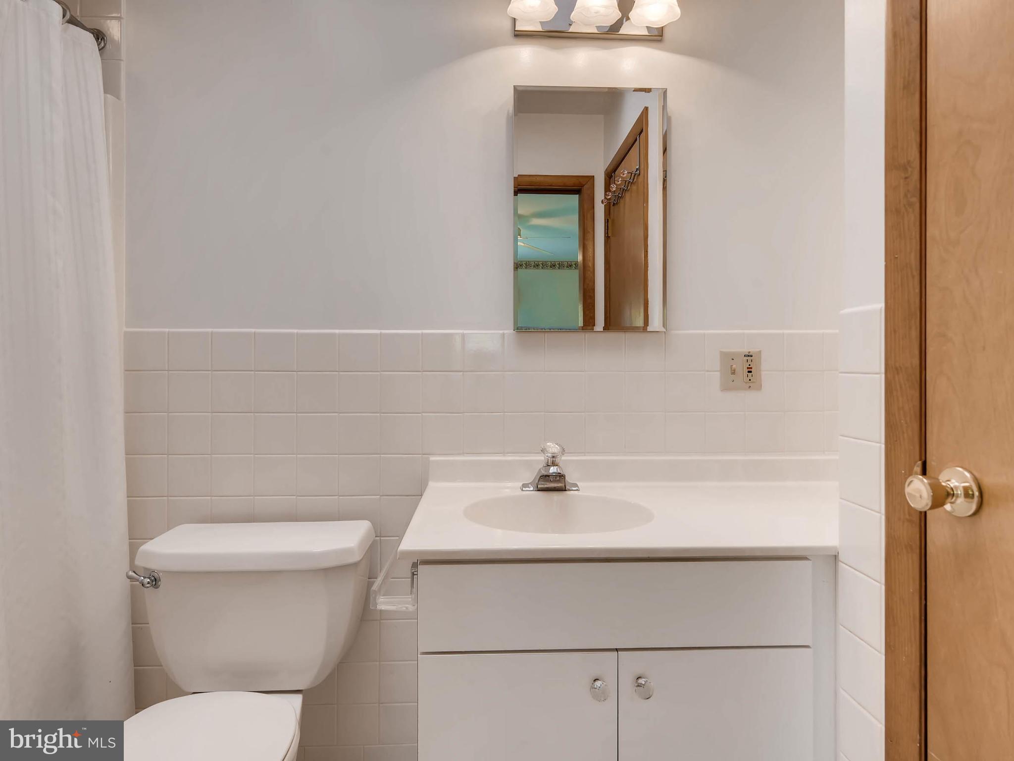 2626 Pleasantville Road Fallston, MD 21047 - Photo 23 of 29 a bathroom with a sink mirror and toilet