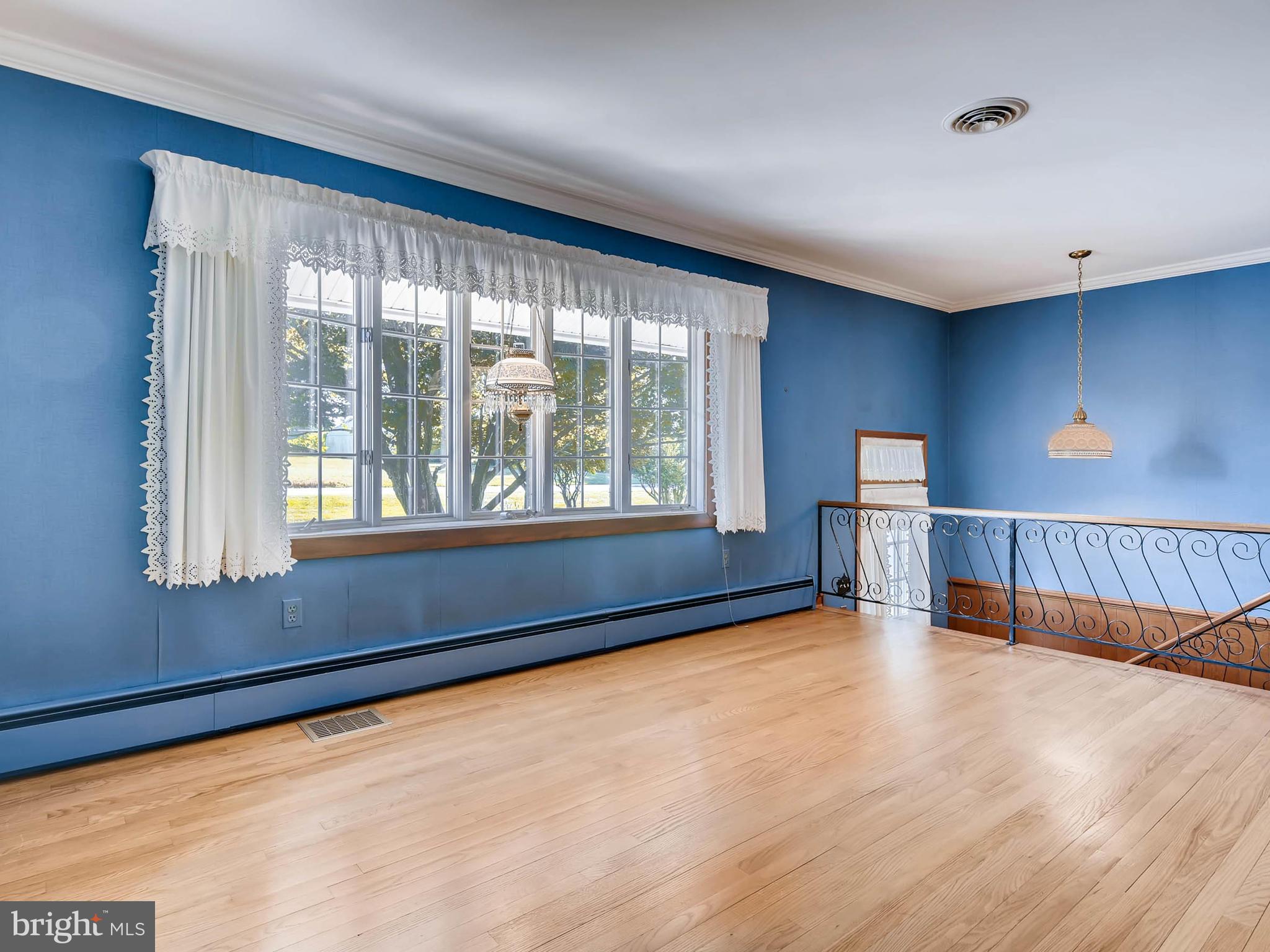 2626 Pleasantville Road Fallston, MD 21047 - Photo 4 of 29 a view of an empty room with wooden floor and a window