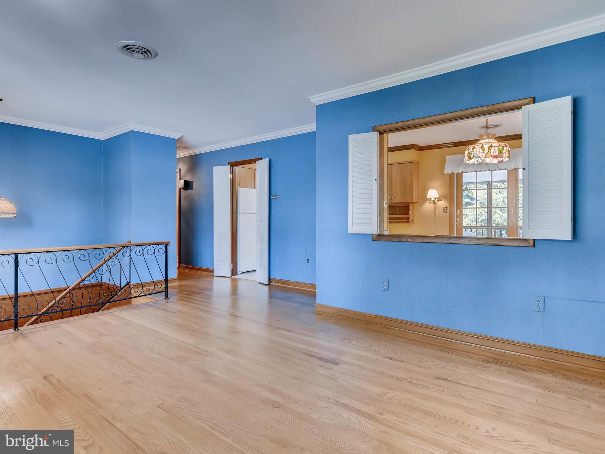 2626 Pleasantville Road Fallston, MD 21047 - Photo 5 of 29 a view of an empty room with wooden floor and a window