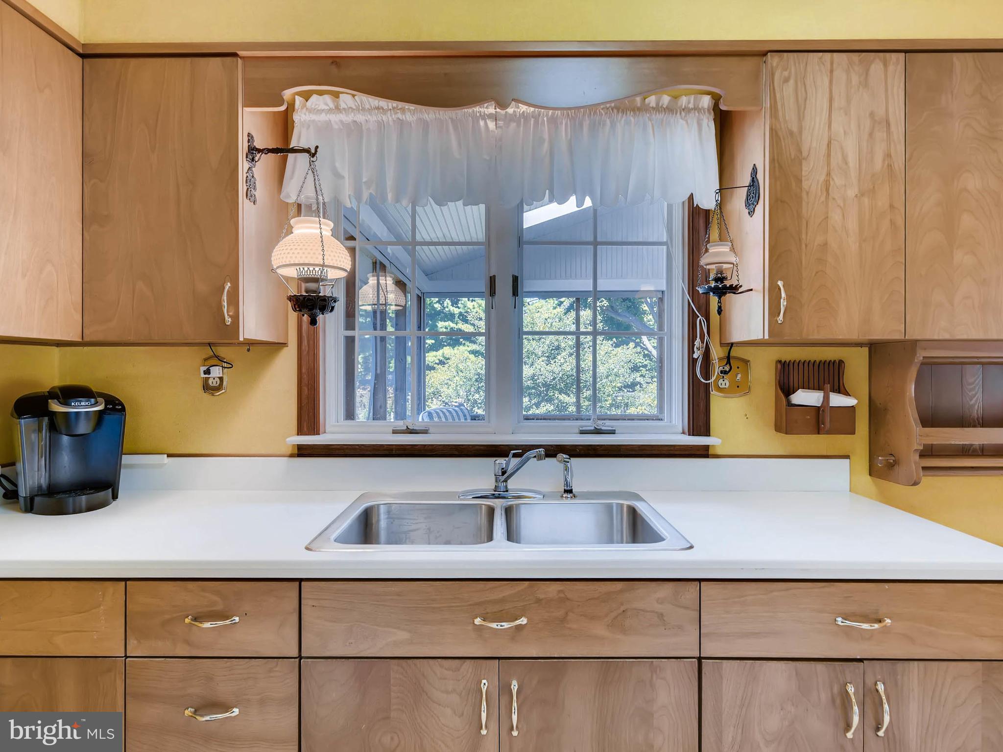 2626 Pleasantville Road Fallston, MD 21047 - Photo 6 of 29 a kitchen with a sink a window and cabinets
