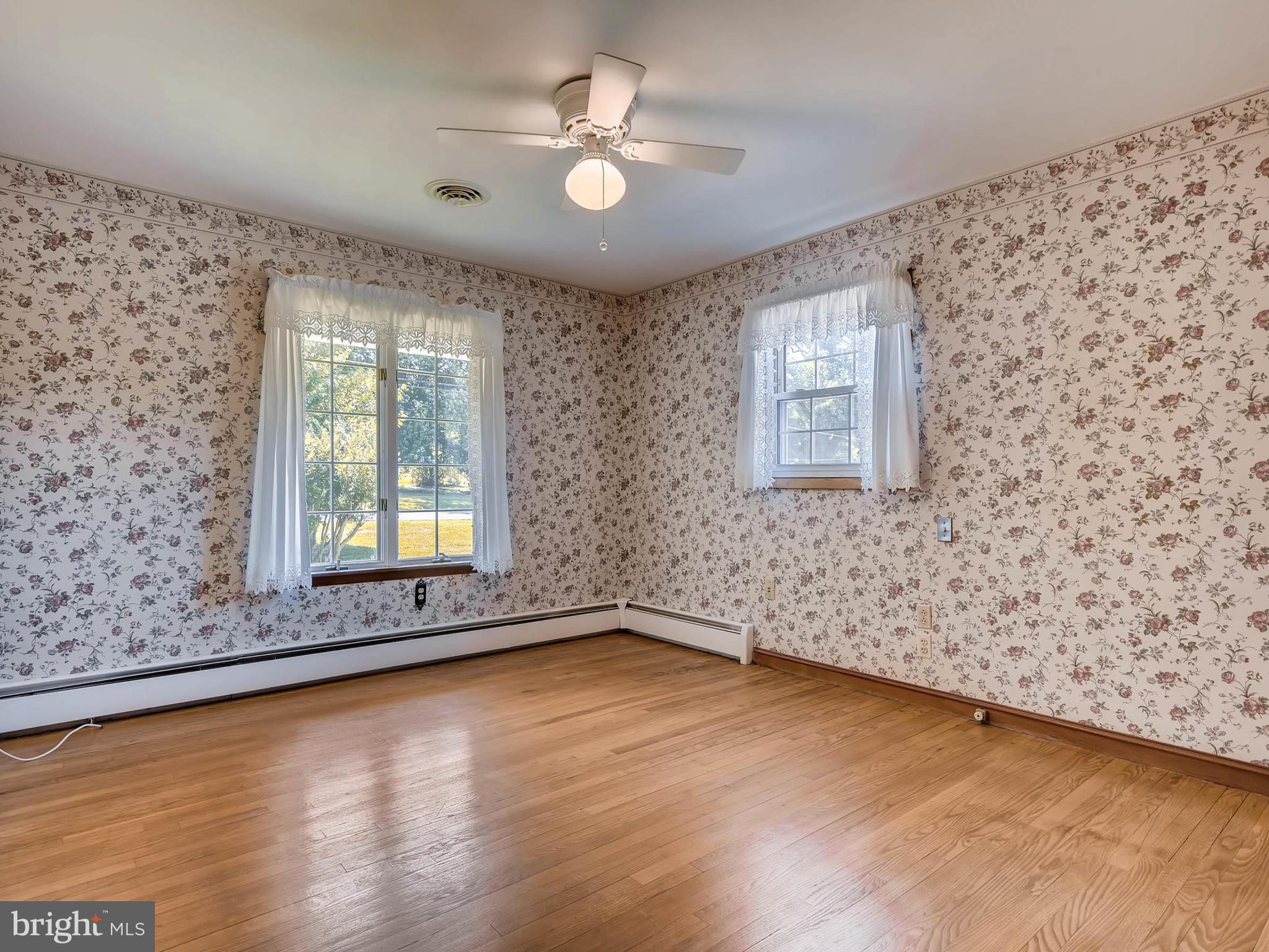 2626 Pleasantville Road Fallston, MD 21047 - Photo 10 of 29 wooden floor in an empty room with a window