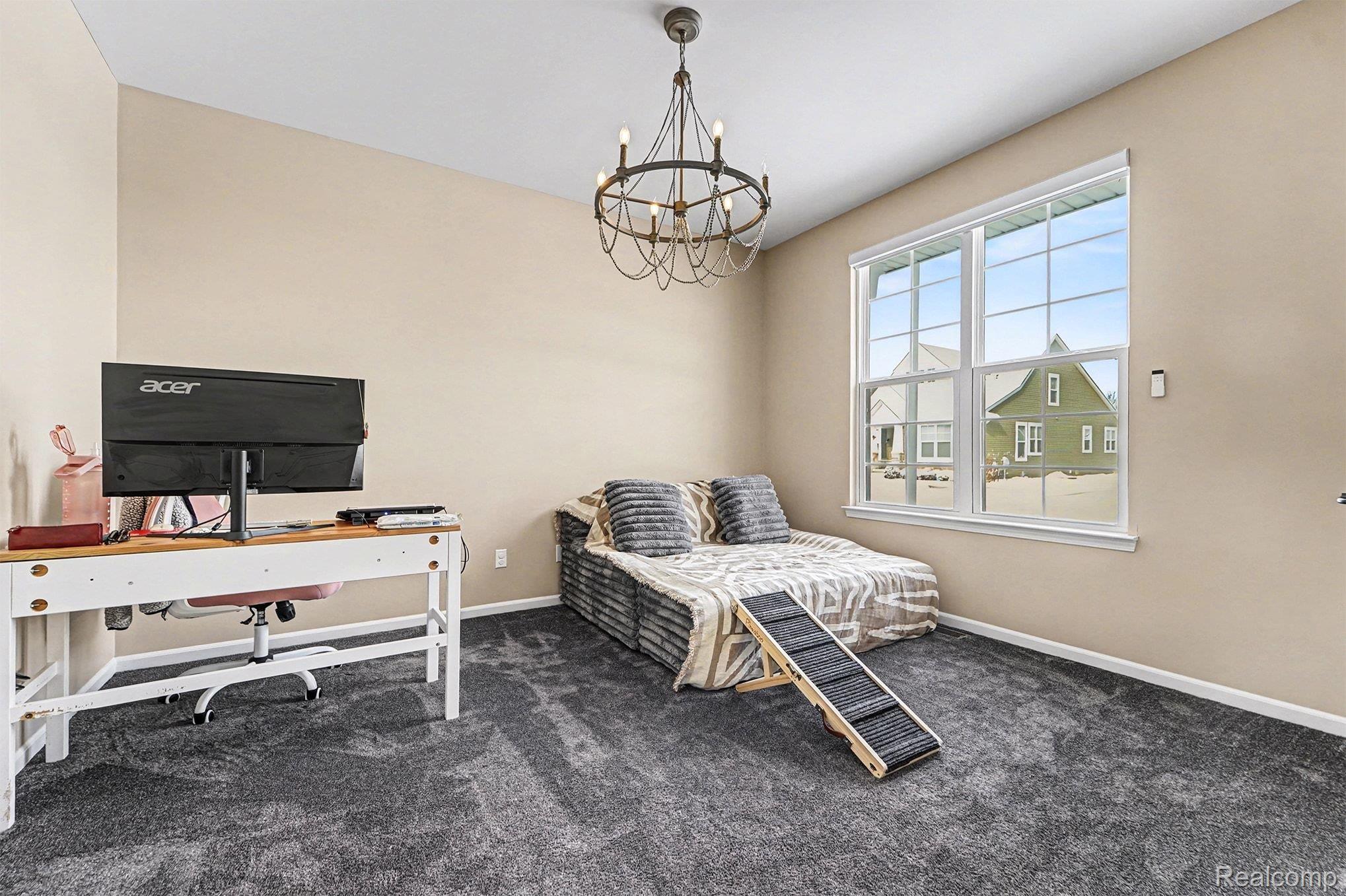 2471 Massoit Road Royal Oak, MI 48073 - Photo 30 of 49 Bedroom featuring dark carpet, a chandelier, and a desk